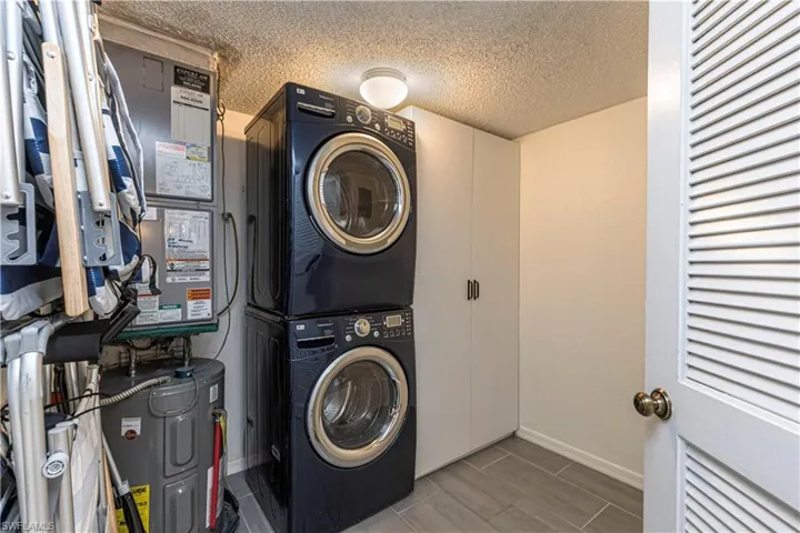 walk in laundry with extra storage space