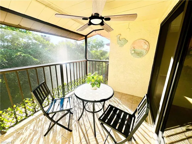 Balcony featuring ceiling fan
