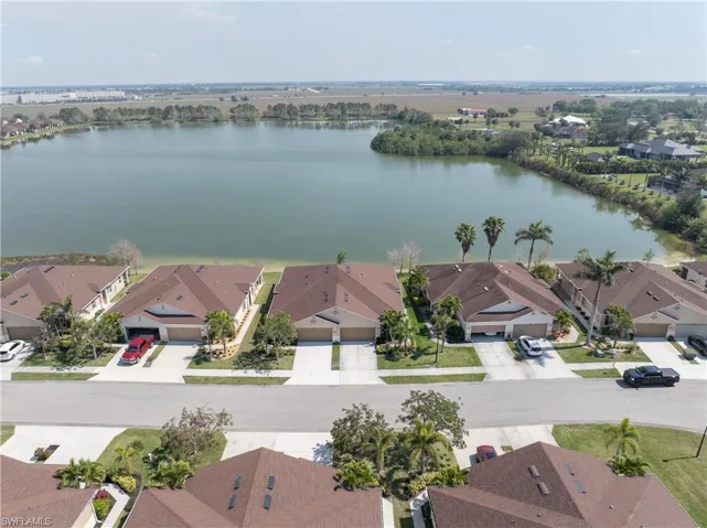 Drone / aerial view featuring a residential view and a water view