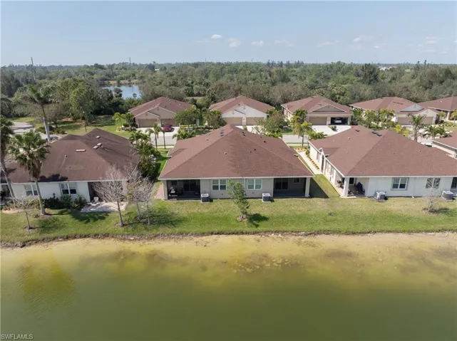 Drone / aerial view featuring a residential view and a water view