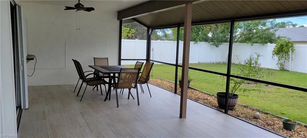 Fully screened large lanai overlooking fully fenced yard.  You will love this new tile!