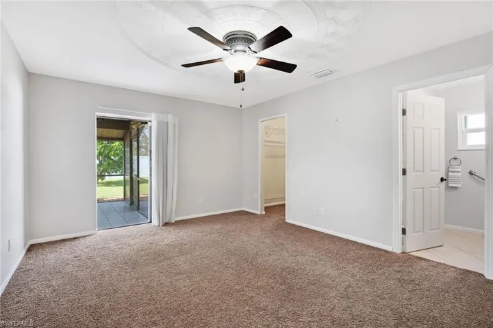 Primary bedroom with en-suite bathroom and large walk-in closet.
