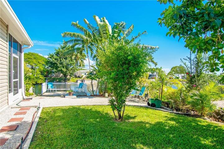 Side yard with sitting area and dock