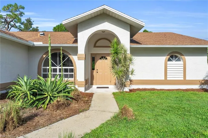 Property entrance with a yard