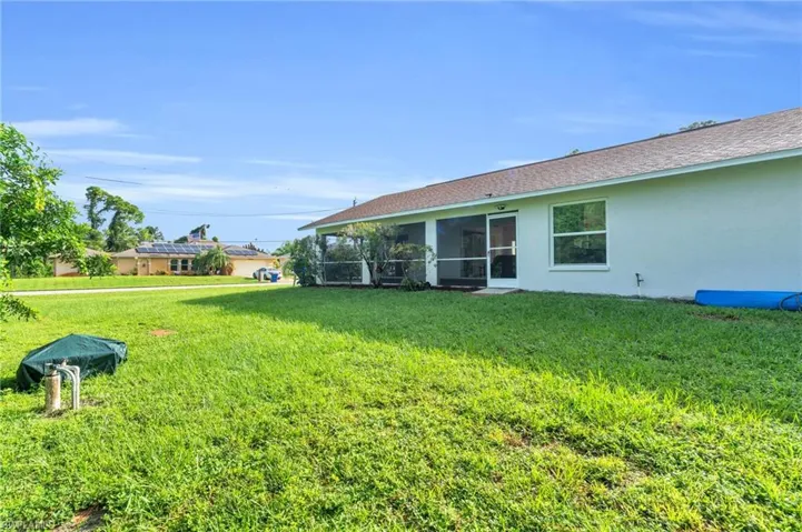 View of yard with a sunroom