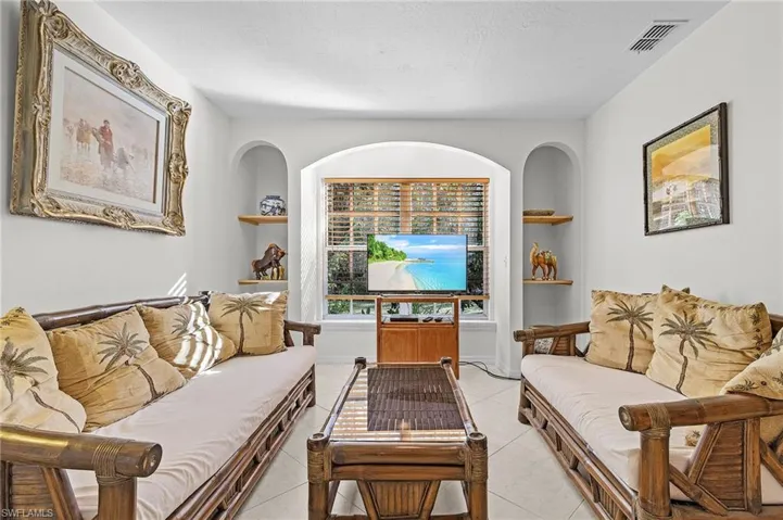 Tiled living room with built in shelves