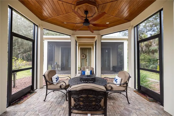 Sunroom / solarium with a ceiling fan
