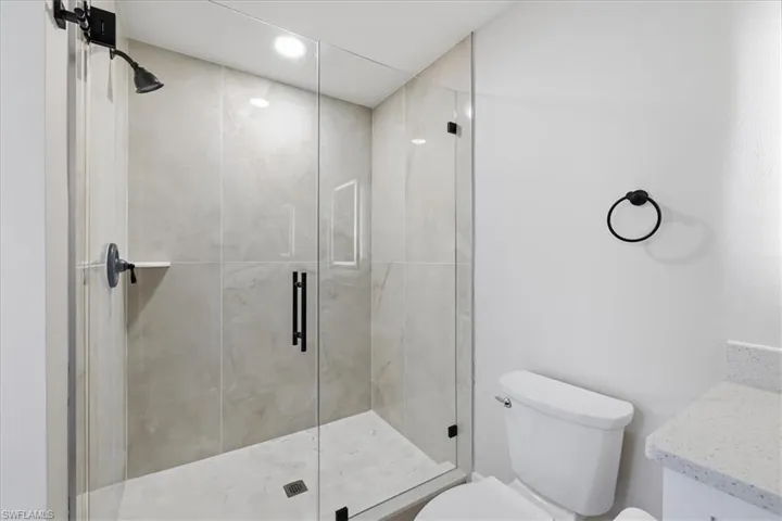 Full bathroom 1  featuring a stall shower and vanity