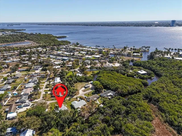 Aerial view of residential area with a large body of water
