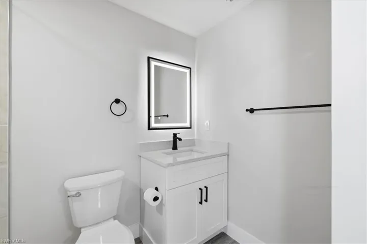 Bathroom 1 with vanity and toilet