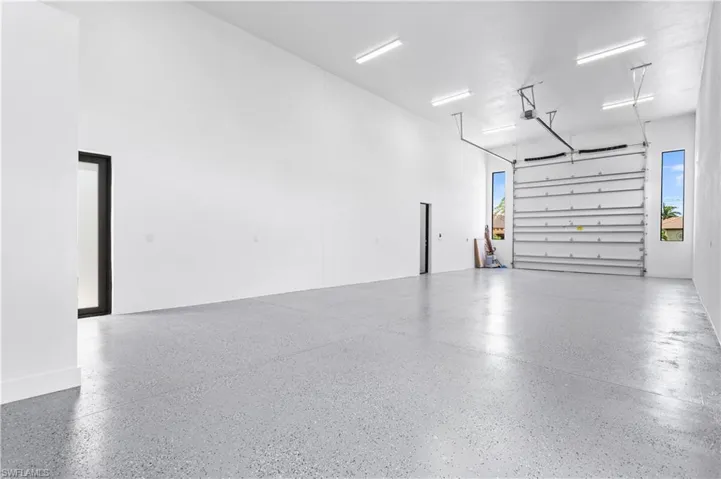 RV GARAGE w/ INSULATED DOORS & CEILING for EFFICIENCY! Big windows for lighting!! RV GARAGE has 55 ft long x 17 ft high!!!