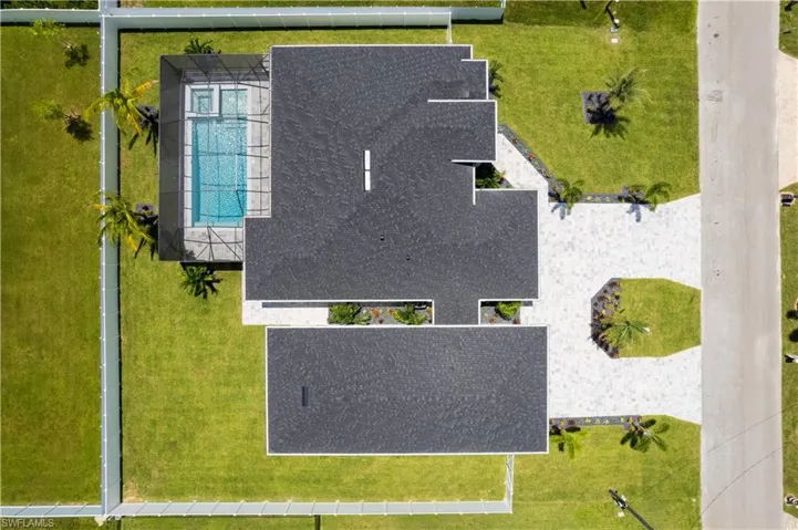 Set on TRIPLE LOT, property offers PLENTY of ROOM for RECREATIONAL VEHICLES, BOATS & PERSONAL WATERCRAFT (RV GARAGE has 55 ft long x 17 ft high)