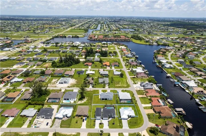 Nestled in SW CAPE CORAL, this OASIS offers 4,003 sq ft total built area.