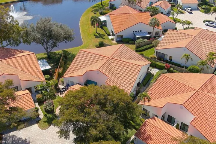 Aerial perspective of suburban area with a large body of water
