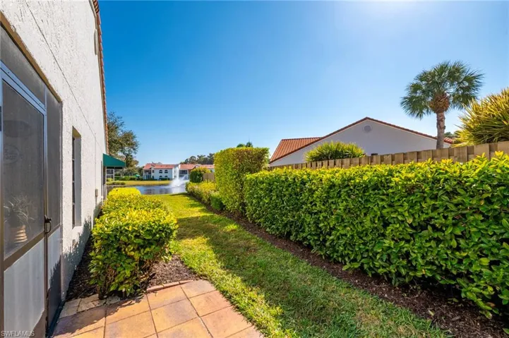View of yard with a water view