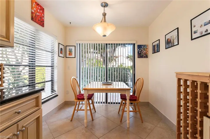 Dining room featuring light tile patterned flooring