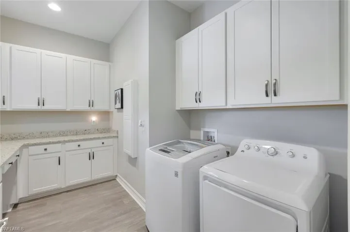 Expansive Laundry with Utility Sink and fabulous storage/counter space