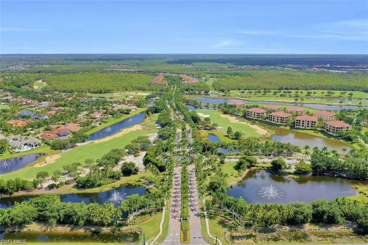 Aerial view of property's location featuring a nearby body of water and a golf club