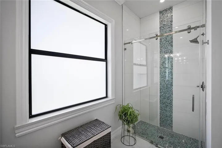 Bathroom featuring walk in shower
