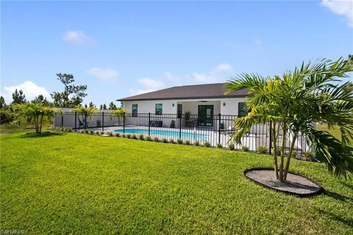View of yard featuring a fenced in pool