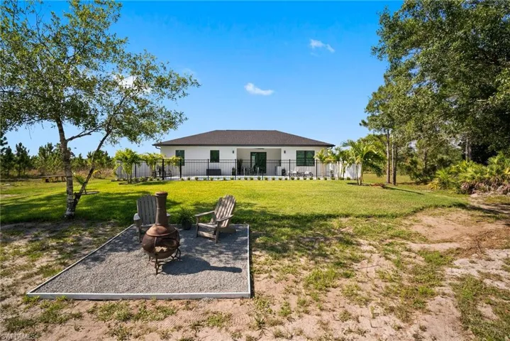 View of yard featuring an outdoor fire pit