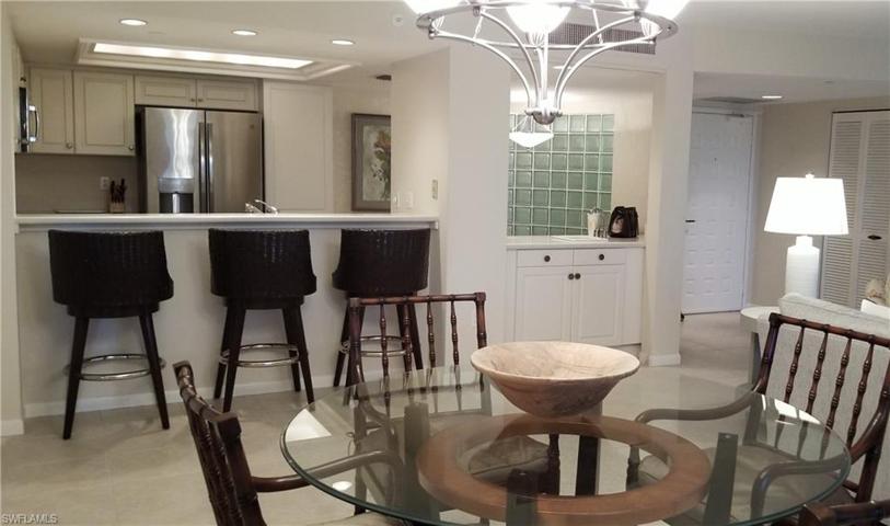 Kitchen is open to the living area, bar seating and dining