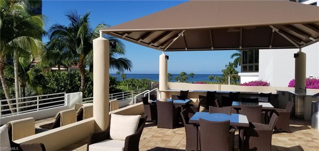 Covered bar/lounge/dining area near the grills