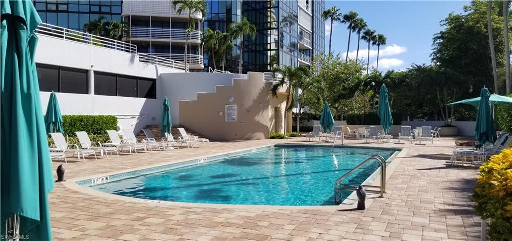 Terracotta pavers, outdoor shower, lounge chairs and umbrellas at the pool for your use. The balcony at your condo overlooks this area from the 5th floor with long views to the gulf