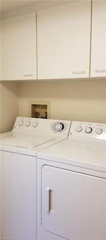 Washer and dryer hidden behind closed doors