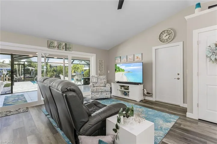 Living Room with views of the pool and lanai.