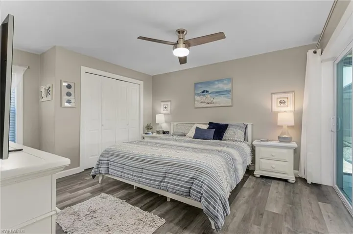 Master Bedroom has sliders to the lanai and pool.