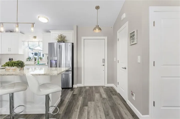 Entry to the home with an additional food storage closet on the right.