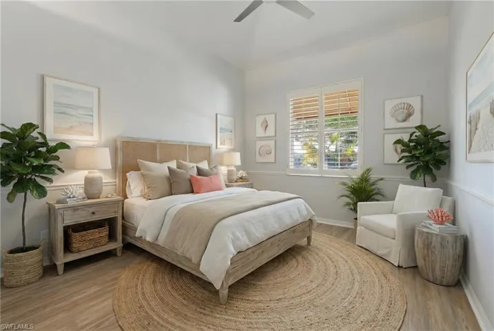 Bedroom with a ceiling fan and light wood finished floors