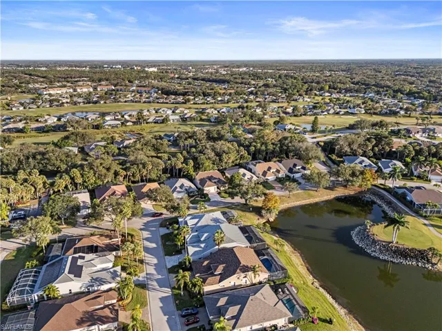 Aerial overview of property's location featuring nearby suburban area and a large body of water