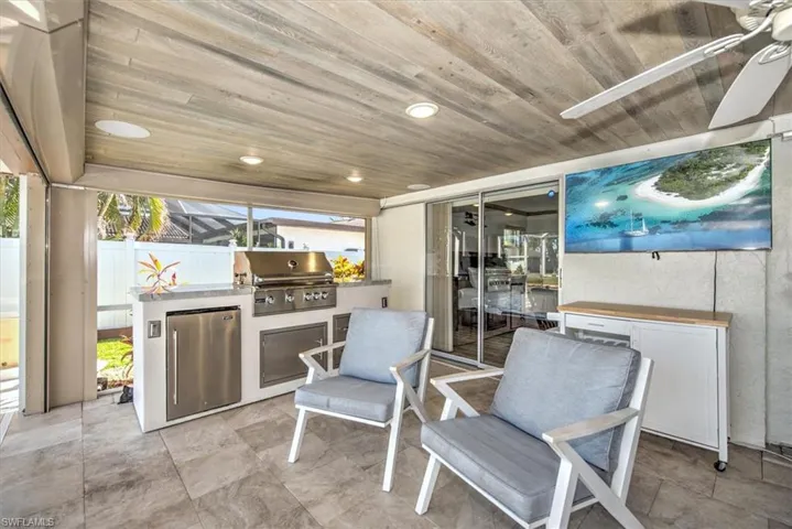 View of patio / terrace with exterior kitchen and ceiling fan