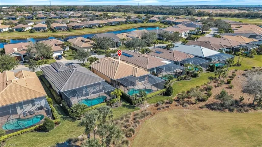 Aerial view of residential area with a large body of water