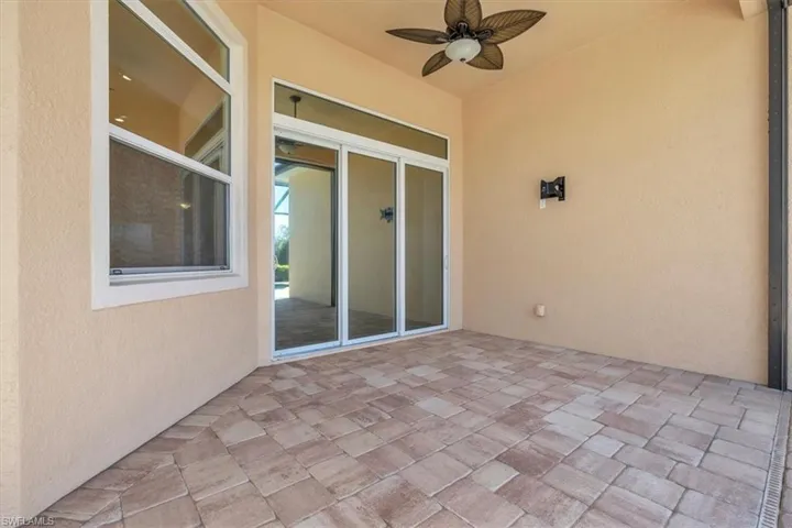 View of patio featuring a ceiling fan