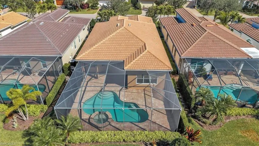 Aerial view of residential area featuring a pool area