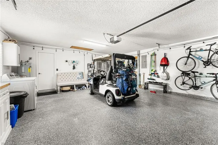 Oversized 2 car garage has a epoxy finished floor.
