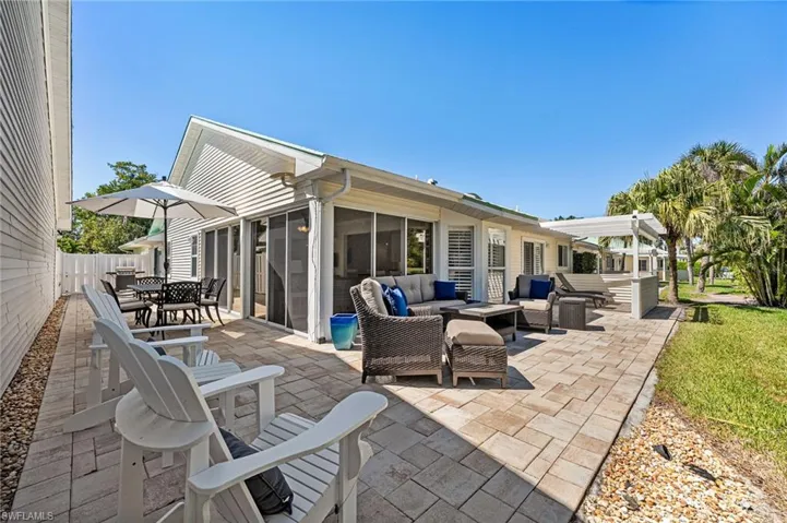 Pavered lanai runs the length and the width of this beautiful villa.  This is a perfect layout for entertaining and relaxing while watching the golfers and nature.