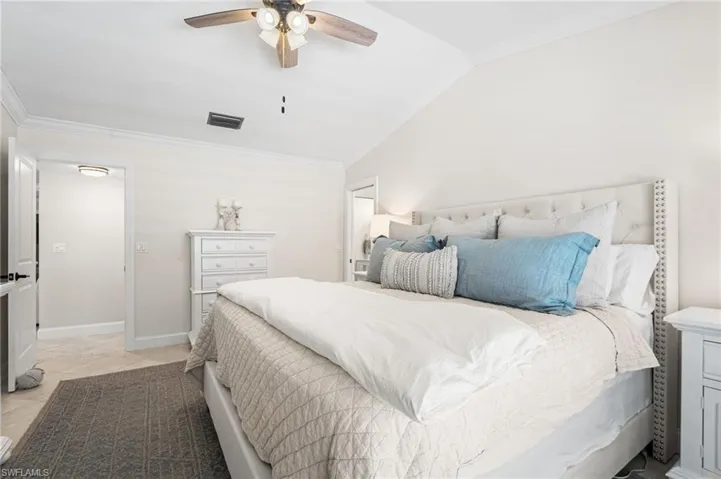 Primary bedroom has vaulted ceilings.