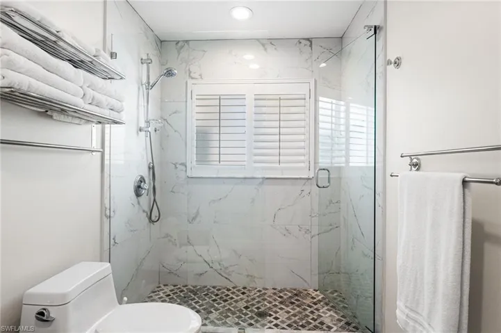 Beautful floor to ceiling tile in the walk in shower.