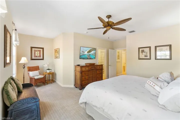 The primary bedroom is located on the second level of this home. It has a private bath and a walk-in closet.