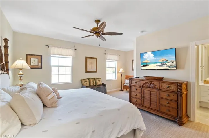 The primary bedroom is located on the second level of this home. It has a private bath and a walk-in closet.