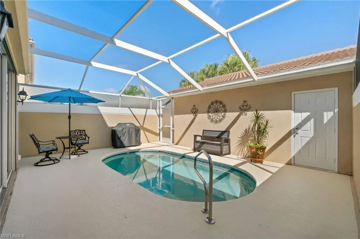 This home has a courtyard pool and a detached garage. The pool is in the courtyard, and the garage is detached from the house.