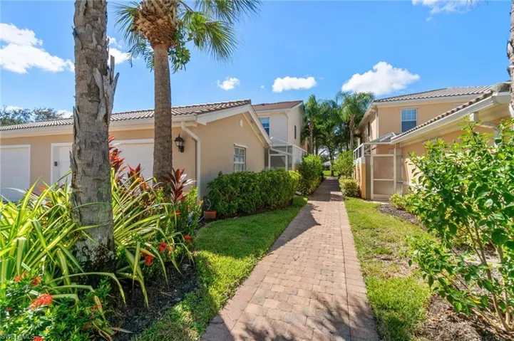 This walkway leads from the street to the garage and then to the townhome. It is a convenient way to access the property.