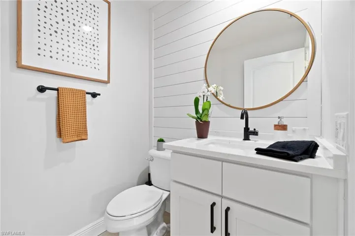 Guest bath with Shiplap wall accent, new vanity and quartz countertop