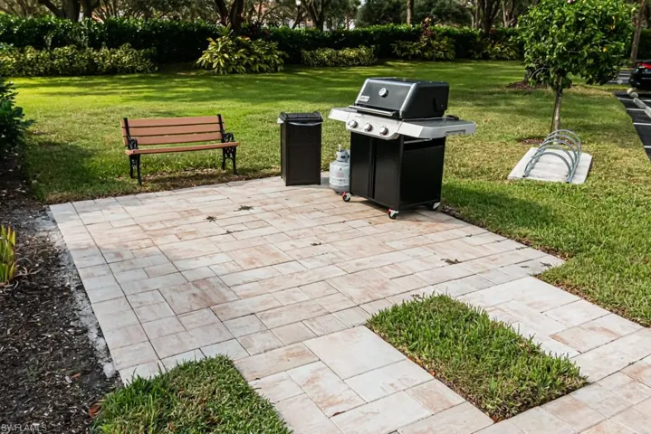 View of patio featuring a grill