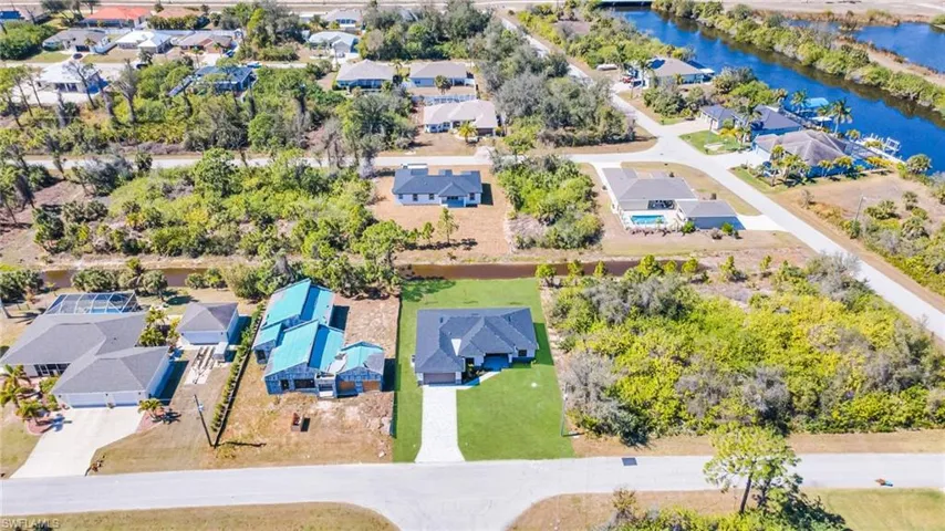 Aerial view of residential area with a large body of water