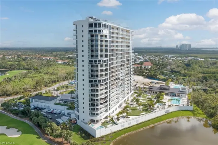 View of building / complex with a water view and golf course view